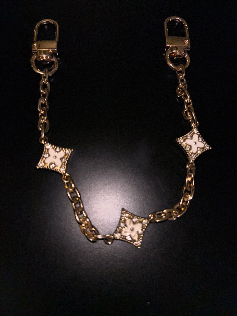 Gold Tone bag jewlery with White Enamel Floral Motifs